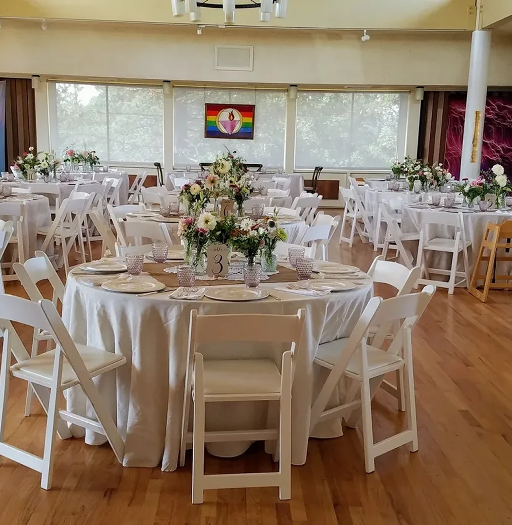 Elegant wedding reception with floral centerpieces.