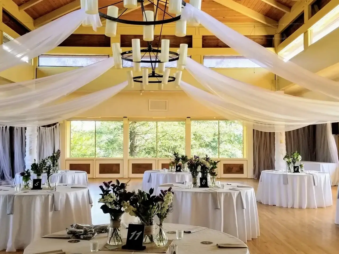 Wedding reception hall with elegantly draped ceiling.