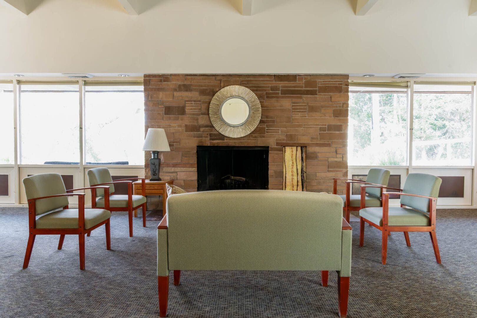 Mid-century modern lounge with brick fireplace.