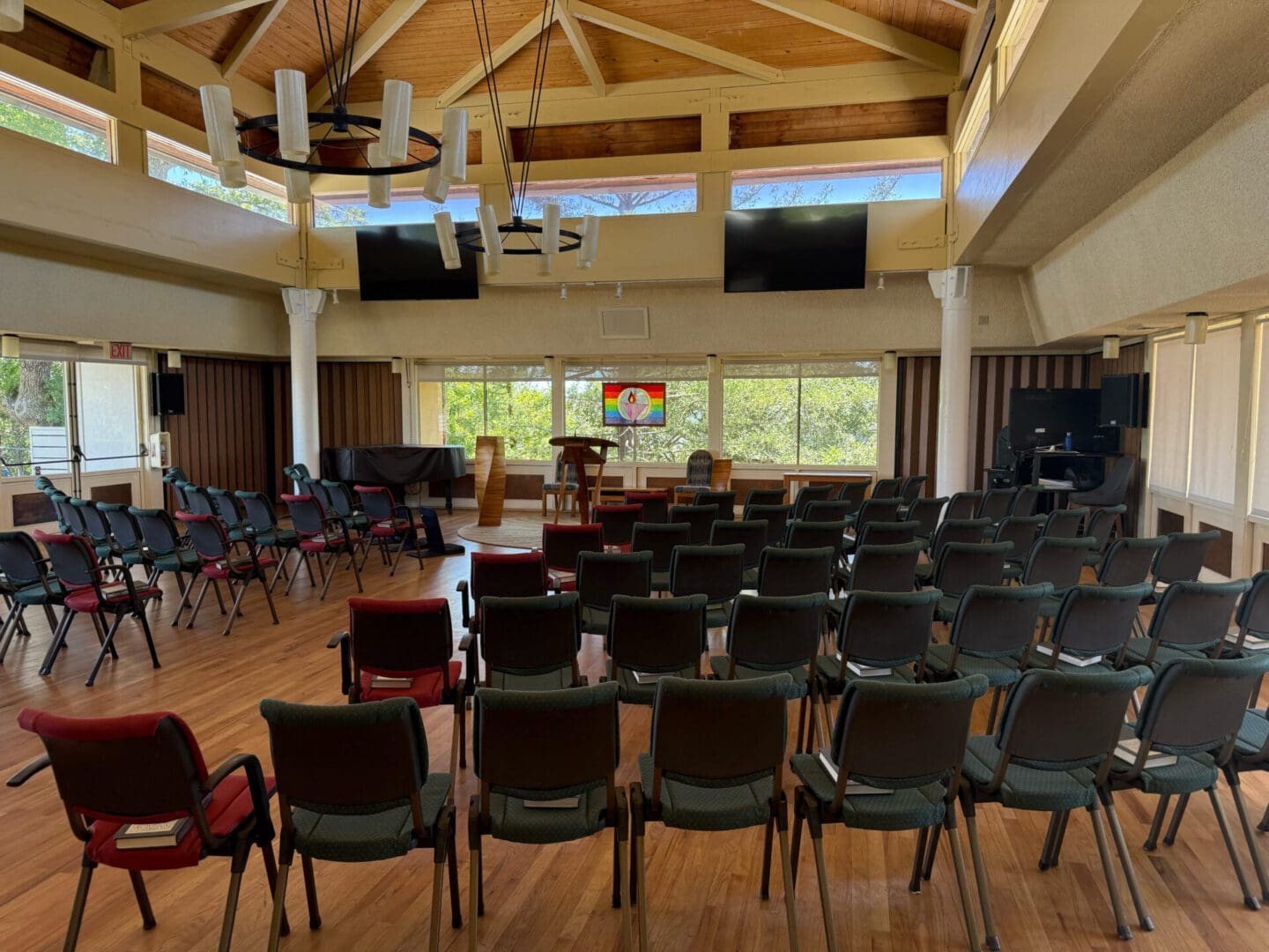 Empty conference room with rows of chairs.