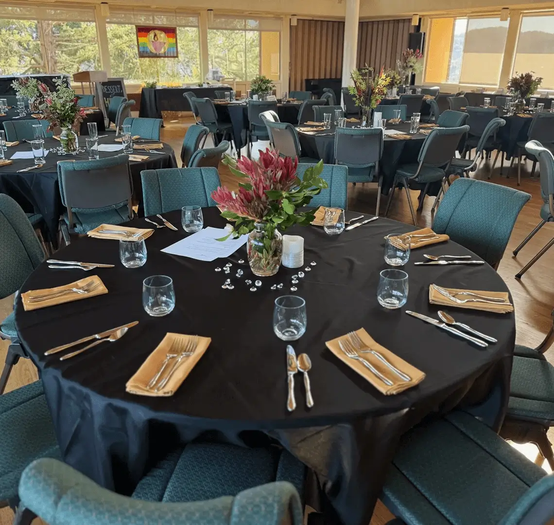 Beautifully set tables with floral centerpieces.